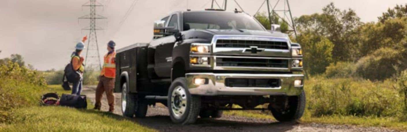 Chevrolet medium-duty truck front view with workers
