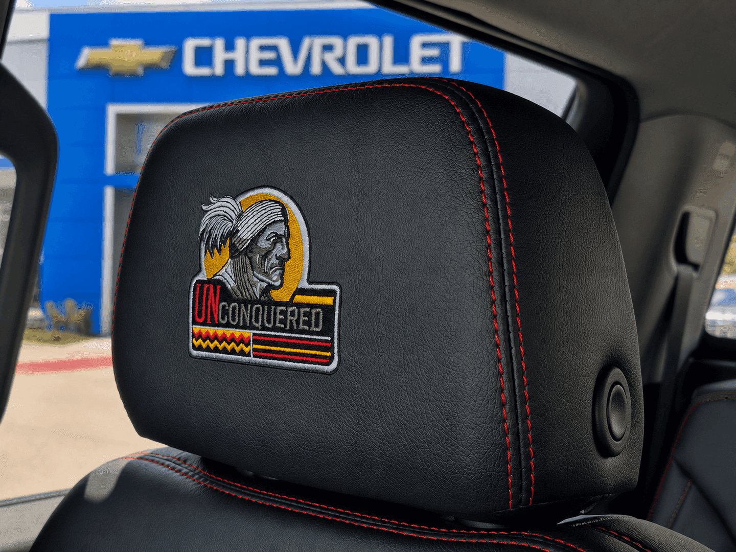 Exclusive Unconquered Edition embroidered headrest