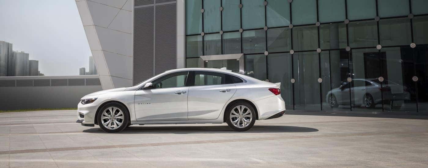 2018 Chevy Malibu parked in front of modern building