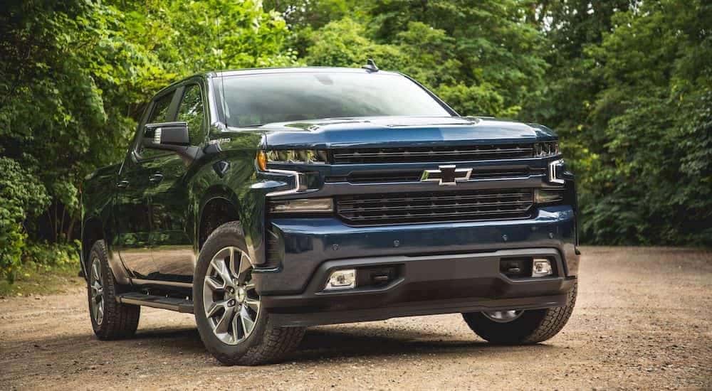 A deep blue 2019 Chevy Silverado on a small dirt road outside Nashville