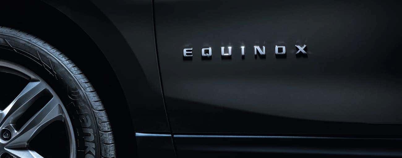 A closeup of the side badging on a black 2019 Chevy Equinox