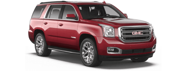 A red 2019 GMC Yukon facing right on white