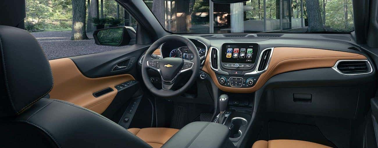The high tech black and tan interior of the 2019 Chevy Equinox