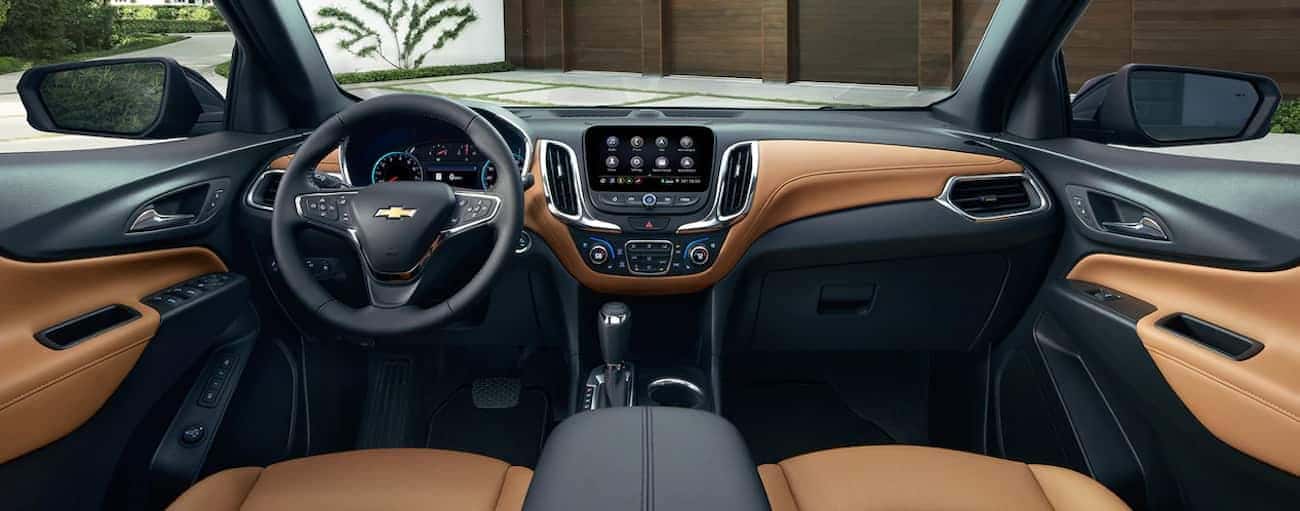 The high tech black and tan leather interior of the 2019 Chevy Equinox