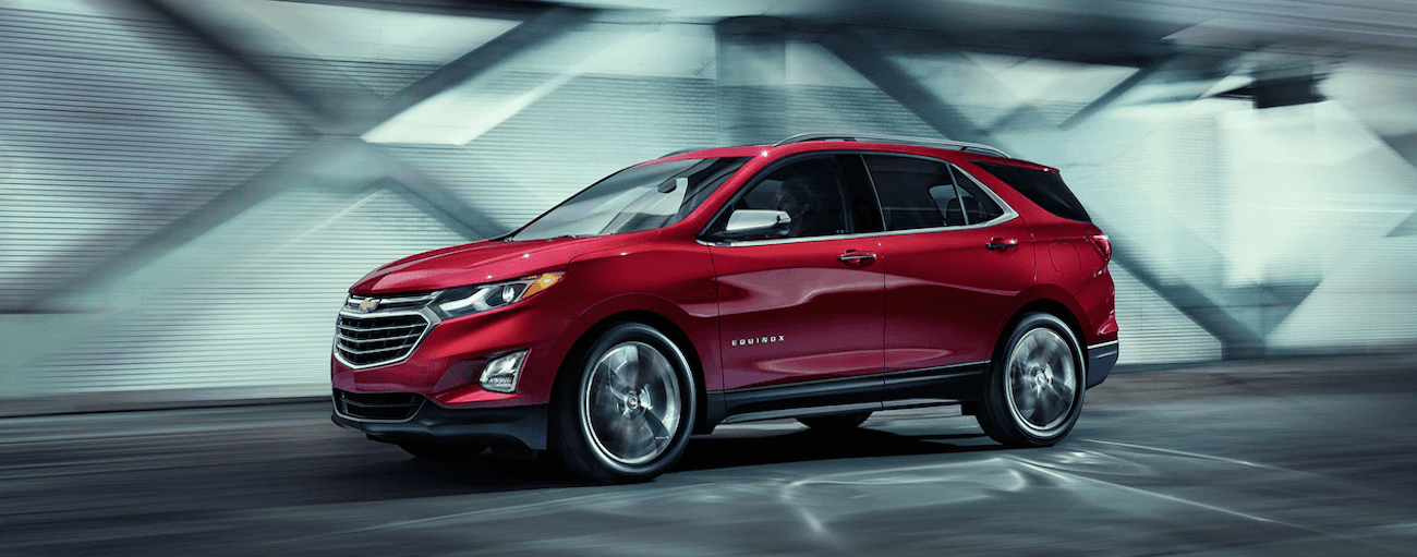 A red 2019 Chevy Equinox travels a city tunnel on a test drive