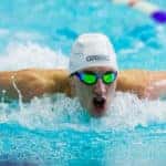 Man swimming in a swimming pool lane