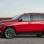 red chevrolet tahoe side view