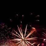 pink fireworks on a black sky