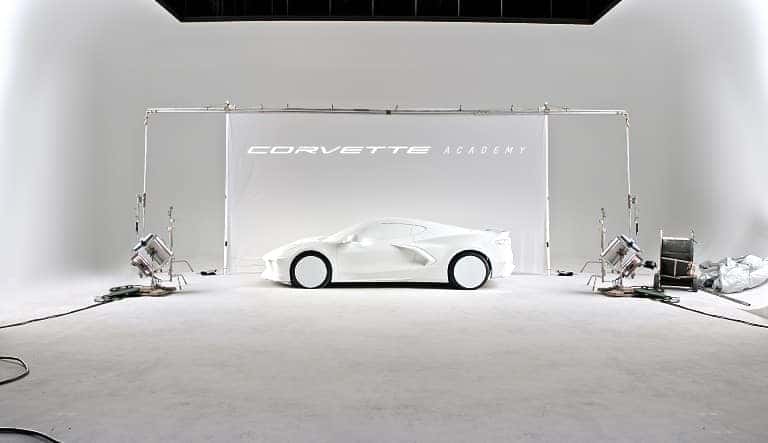 white Chevrolet Corvette in white room