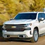 2020 Chevrolet Silverado on a road with a boat