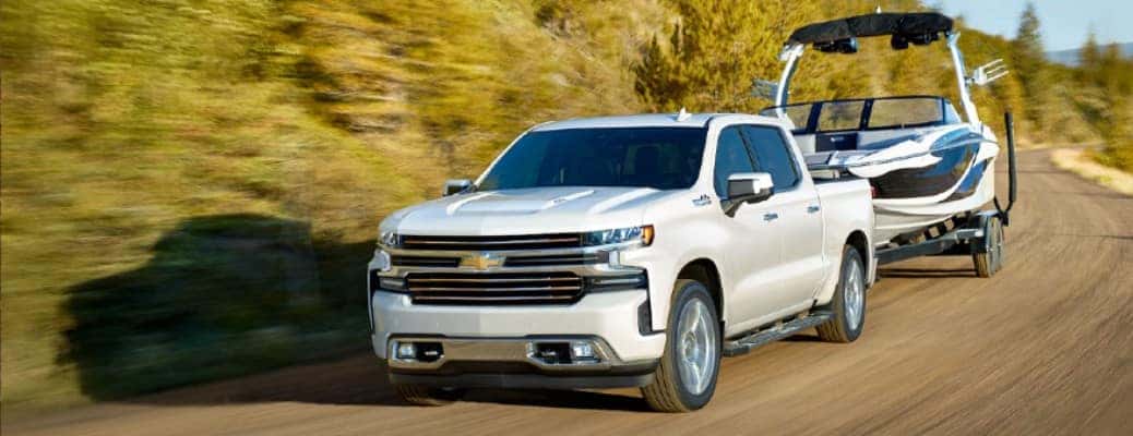 2020 Chevrolet Silverado on a road with a boat