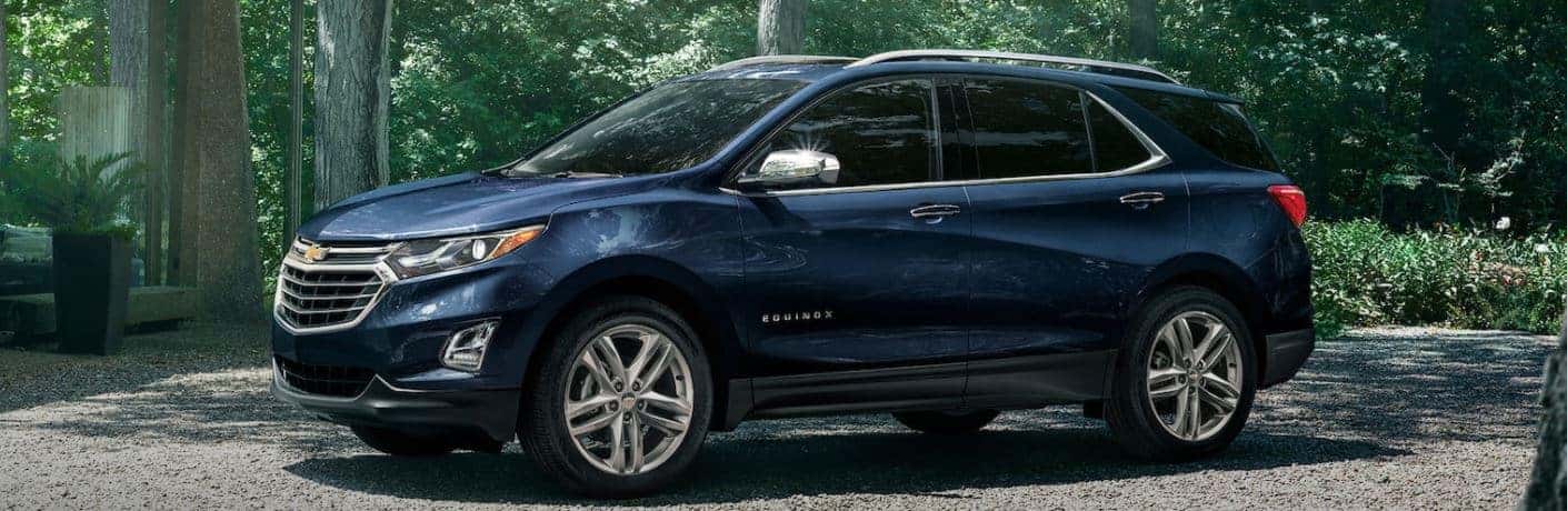 2021 Chevrolet Equinox side view in a forest
