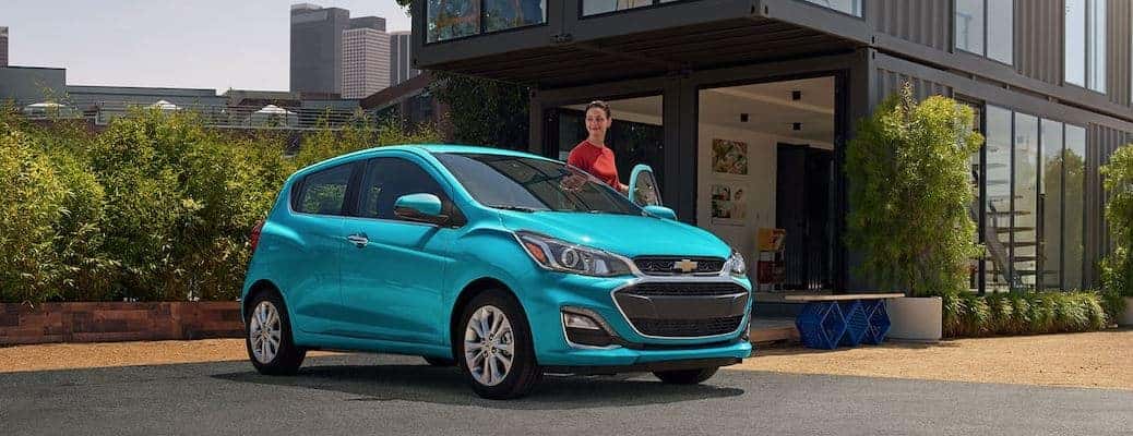 2021 Chevrolet Spark by a house and person