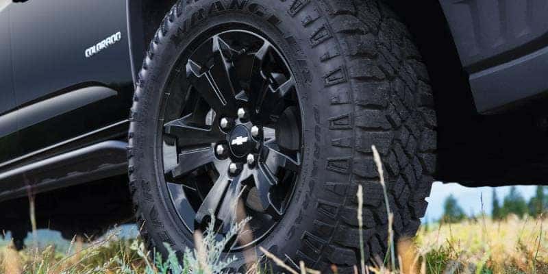 A close up of the rugged wheel and tire on the 2022 Chevy Colorado Z71