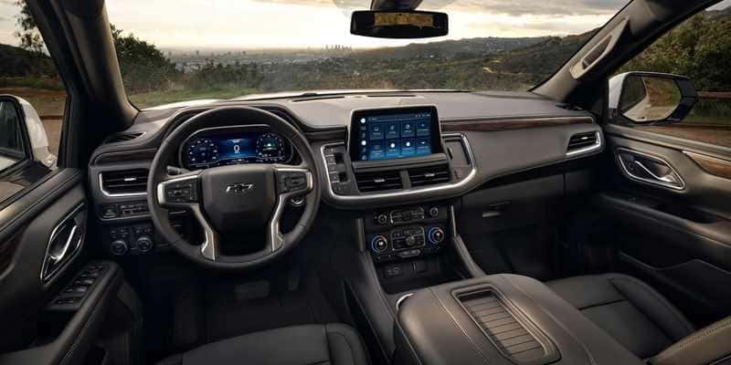 The controls, displays, dashboard, and windshield in the 2023 Chevy Tahoe.