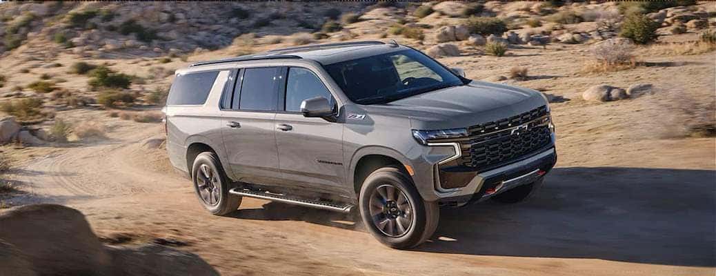 The 2023 Chevy Suburban driving off-road.