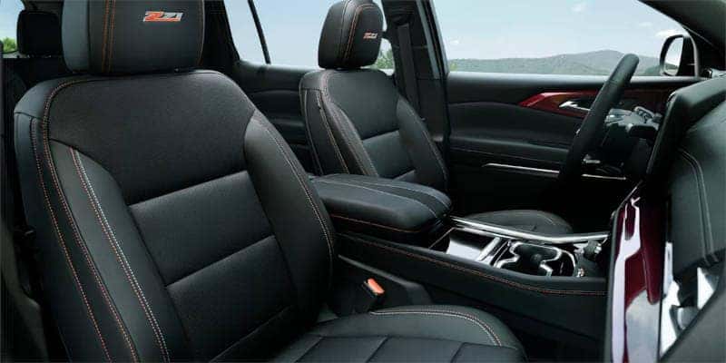 The perforated leather interior of a higher trim level found in the 2023 Chevy Traverse.