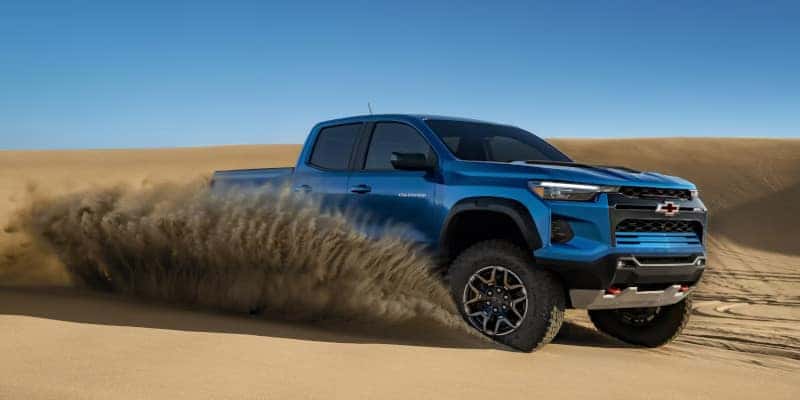 The 2023 Chevy Colorado ripping through the sand.