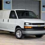 A 2023 Chevy Express Van being loaded at a warehouse.