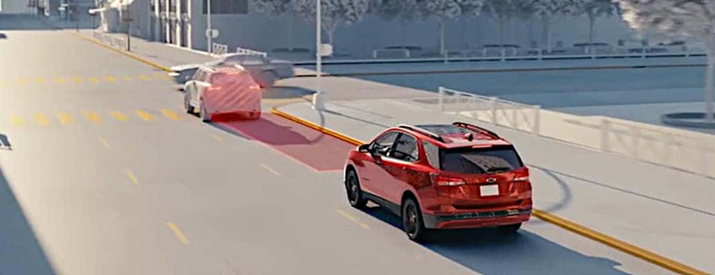 A dramatization of forward collision alert, one of the many safety features in the 2024 Chevy Equinox.