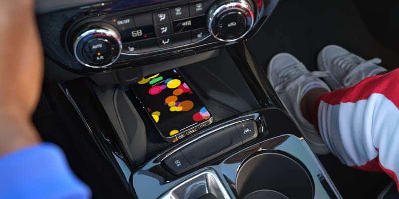 The available wireless charging station in the 2025 Chevy Trax.