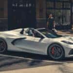 A man standing next to his new Corvette Stingray.