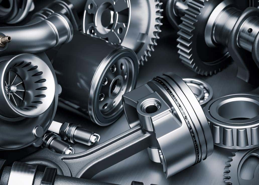 Automotive engine components and replacement parts displayed for vehicle maintenance and repair.