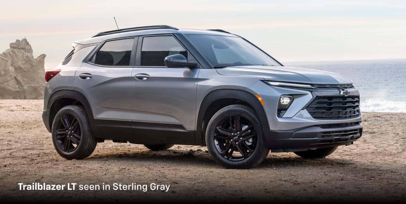 2026 Chevrolet Trailblazer LT in Sterling Gray, front three-quarter view parked by a rocky ocean shoreline.