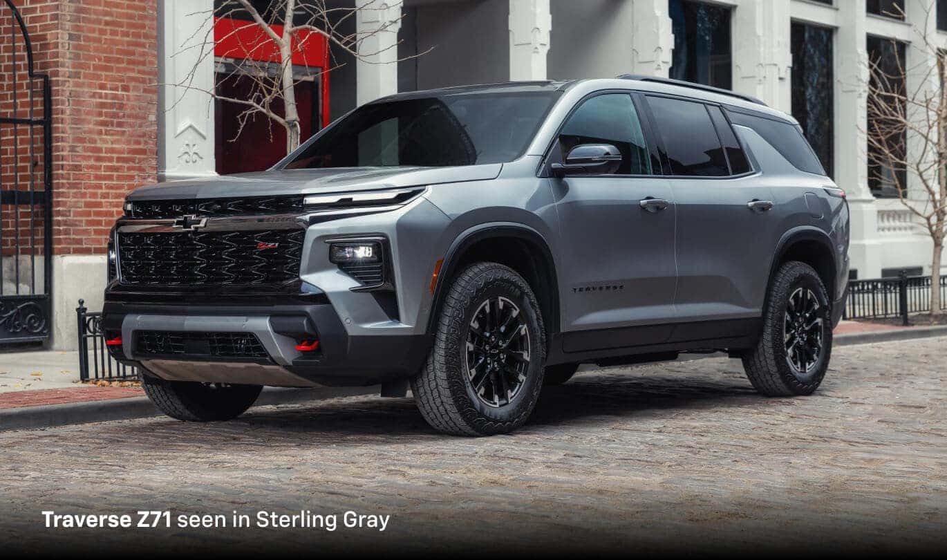 2026 Chevrolet Traverse Z71 in Sterling Gray, front three-quarter view parked on a cobblestone street in St. Louis.