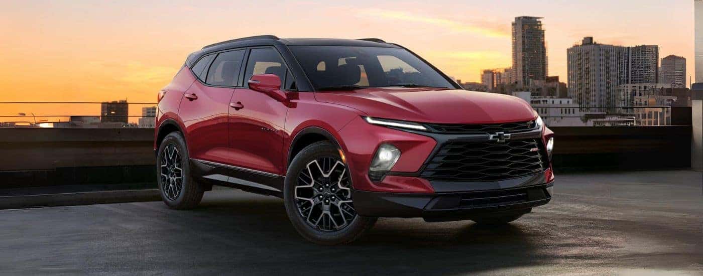 A red 2024 Chevy Blazer for sale at sunset..