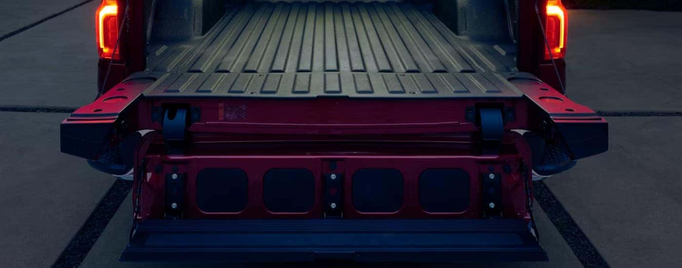 An open Multiflex tailgate on a red 2025 Chevy Silverado 1500 for sale near Manchester. 