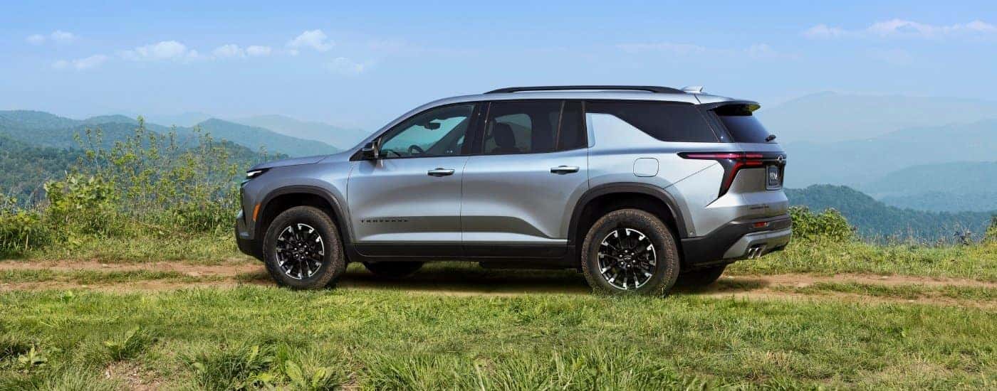 A silver 2024 Chevy Traverse Z71 is shown from the side.