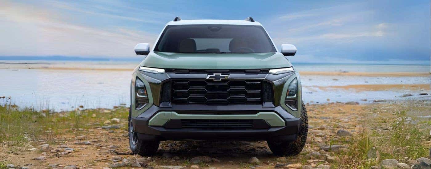 A green 2025 Chevy Equinox ACTIV parked near water