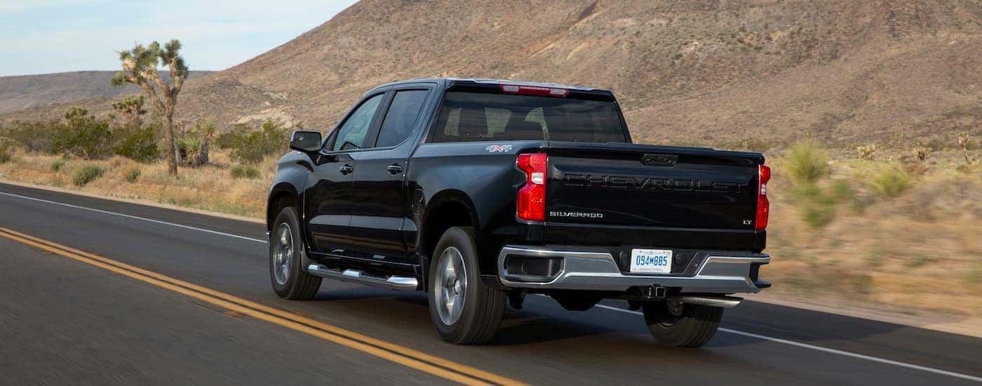 A black 2022 Chevy silverado 1500 from the rear at an angle.
