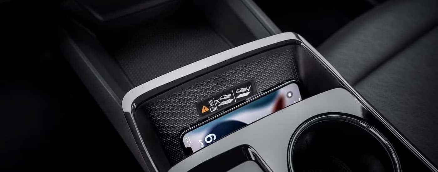 A phone charging in the center console in a 2025 Chevy Equinox.
