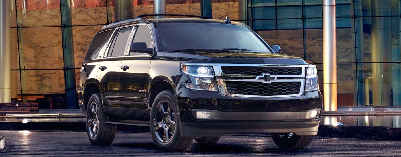 Black 2017 Chevy Tahoe parked in front of a building to look at used Chevys for sale near Coventry
