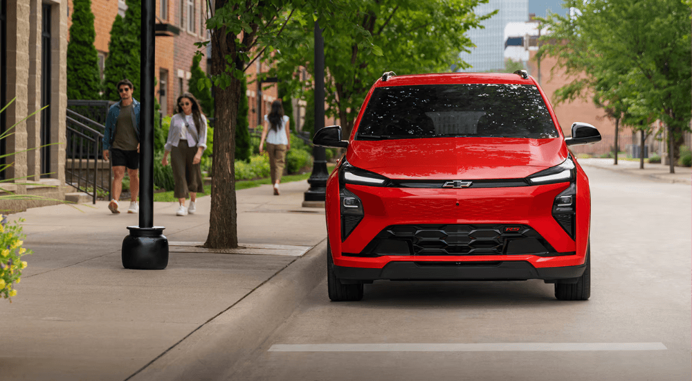 Red 2026 Chevy Bolt for sale parked on the street