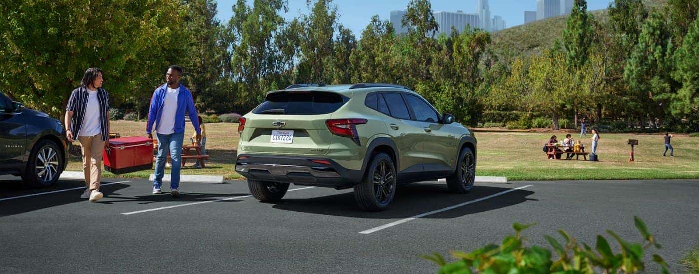 Rear of a green 2025 Chevy Trax ACTIV parked on a parking lot.