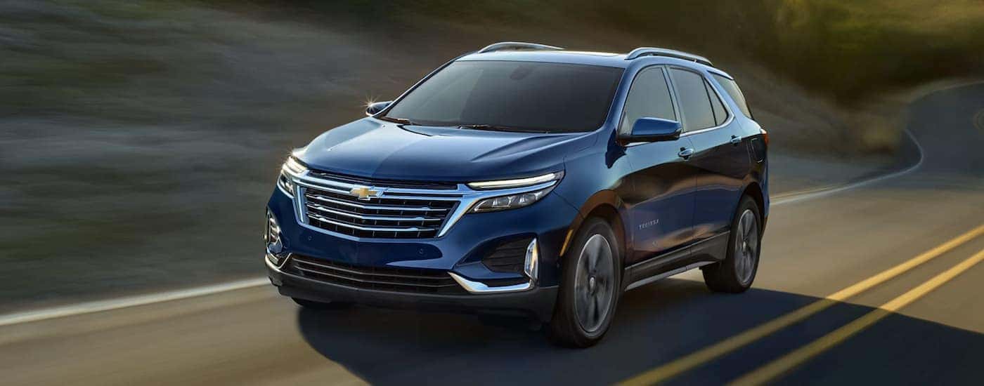 Blue 2022 Chevy Equinox driving on an open road