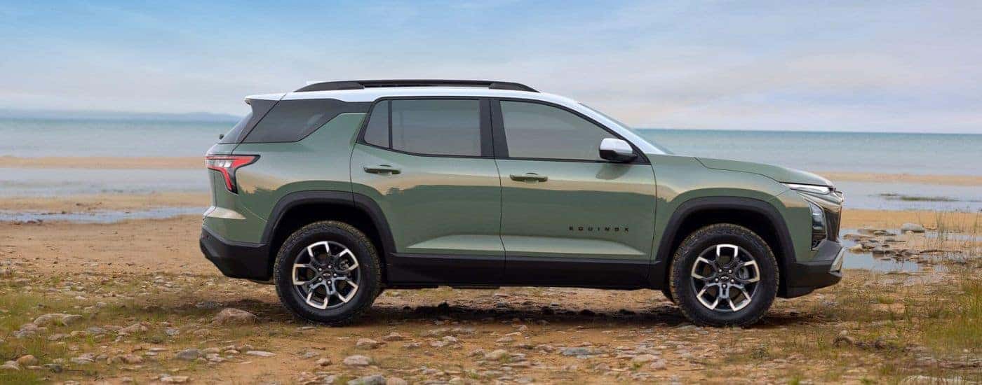 Side profile of a green 2026 Chevy Equinox ACTIV