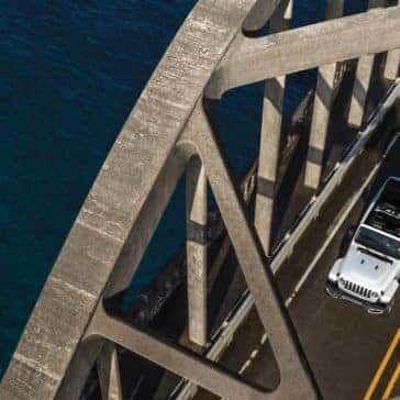 2019 Jeep Wrangler driving on bridge