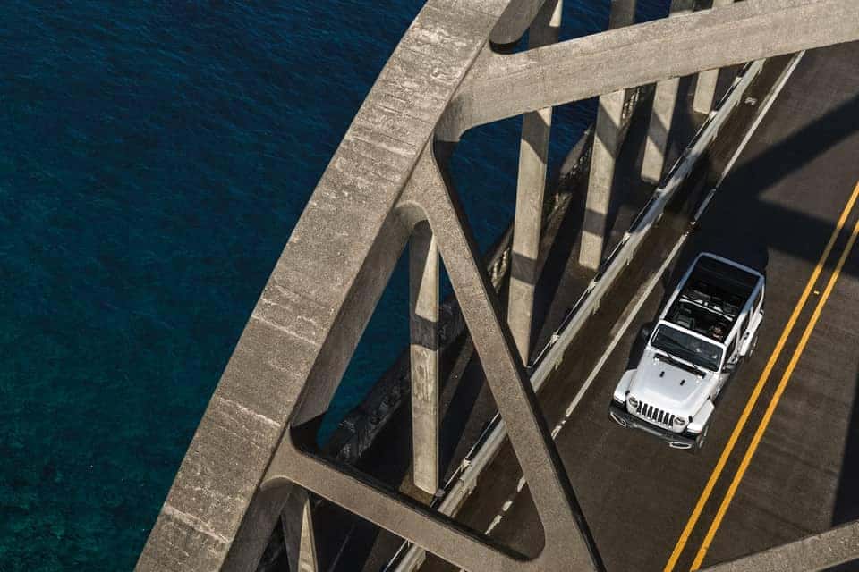2019 Jeep Wrangler driving on bridge
