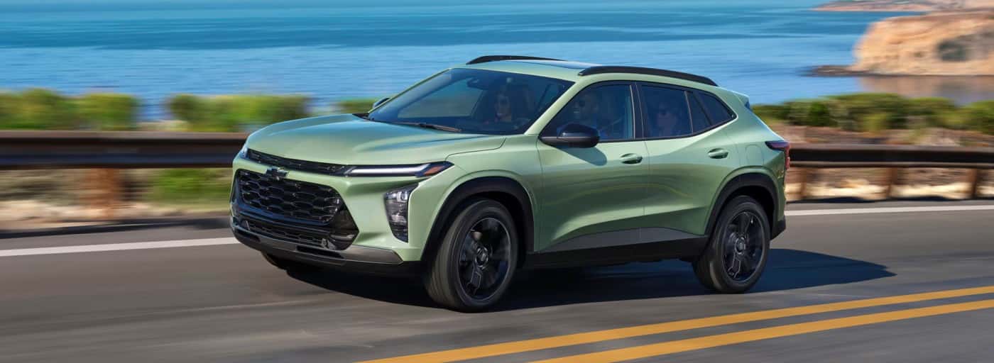 Green Chevy trax running on highway