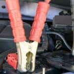Jumper cables attached to car battery