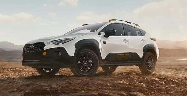 A white 2026 Subaru Crosstrek parked in a desert.
