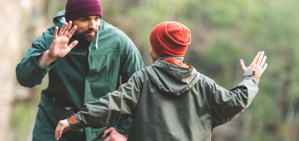 Volunteer High Fiving a Child