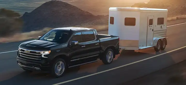 A Chevrolet towing a trailer in Metro Detroit