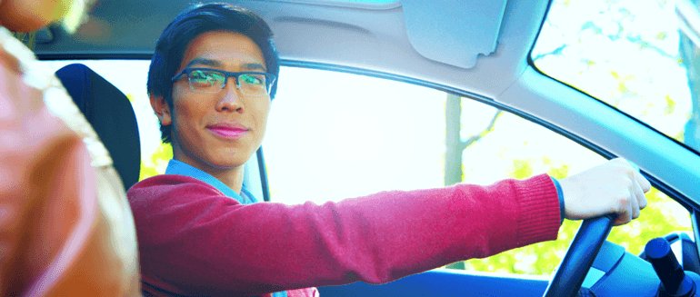 Man Test Driving a Car