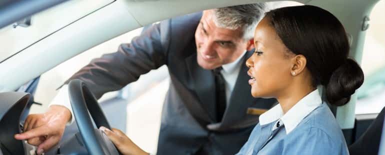 Woman looking at a car