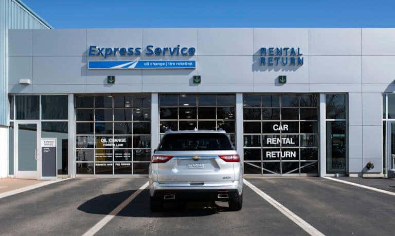 Chevy Vehicle Parked In Front Of Service Center